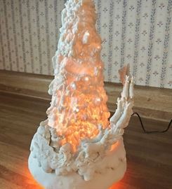 Rotating, lighted ceramic Christmas tree with Santa and his team heading to the skies