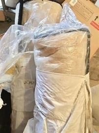 Selection of wool area rugs and runners remain in original packaging for gift-giving surprise!