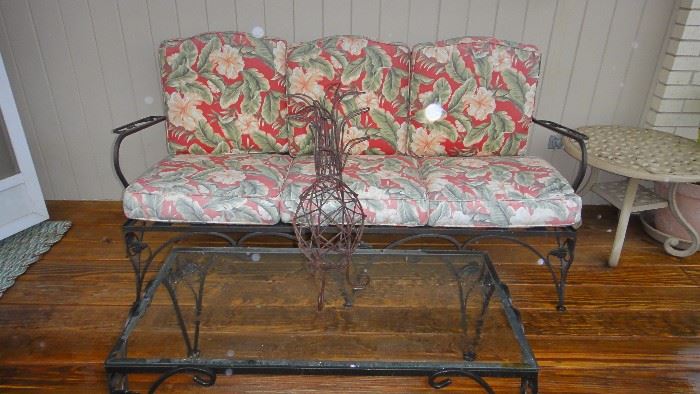 Wrought iron patio sofa and matching table 