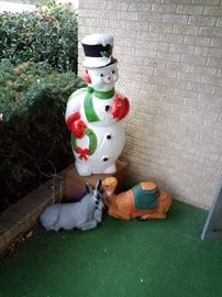 Plastic snowman lights up, camel and donkey. Outside Christmas decorations 