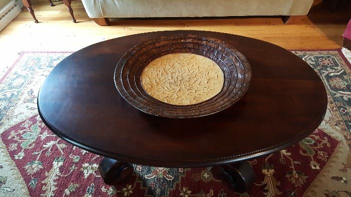 Oval table in dark walnut finish from Charles Cudd