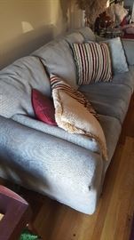 Sofa in very good condition. The color in this photo is inacurate, it is more of a olive green shade. There is also a matching love seat, also in very good condition.