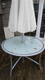 Aluminum outdoor table. Has matching chairs & end tables.