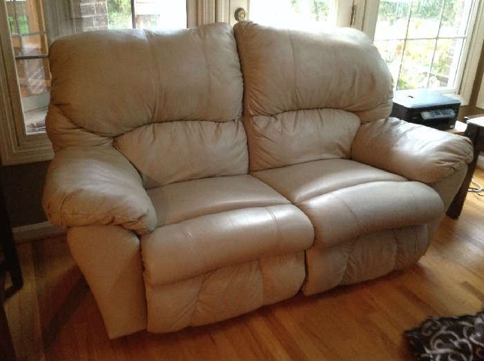 Leather loveseat - reclines on both side $ 300.00