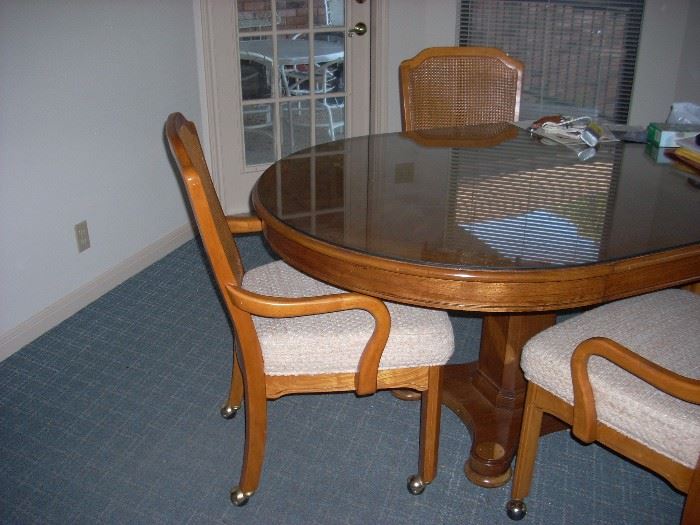 Oval Wood Table with 4 Chairs (on rollers)