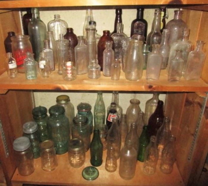 Collection of antique bottles, jars