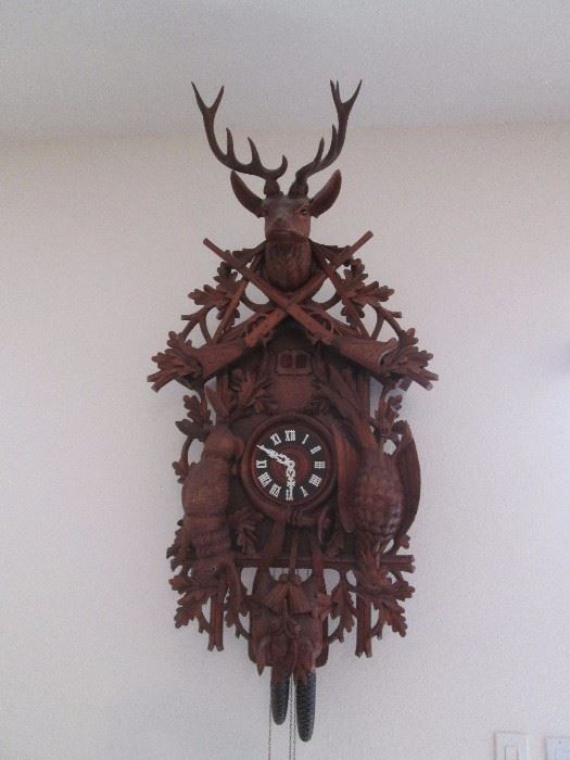 Extraordinary Cuckoo Clock, "After The Hunt", carved in the Black Forest of Germany by Hubert Herr, a master carver.  Circa 1970's.   Works fine!    28" wide X 54" high.                                      