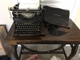 1913 Underwood typewriter with cover and charming old side table with drawers