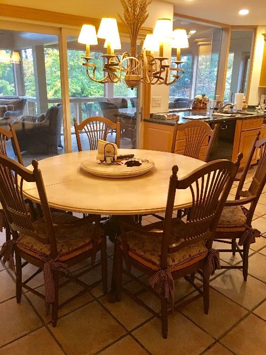 Table has two additional leaves and removeable Lazy Susan (pictured).  Six chairs w/ rush seats.