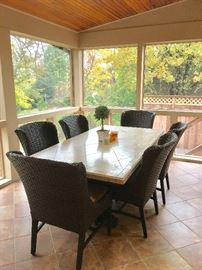 Stone dining table w/woven natural fiber chairs