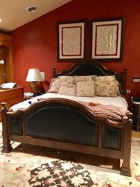 King-sized bed w/ hob-nailed black leather upholstered head and foot board
