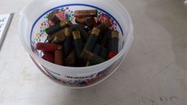 Bucket of 12 g, 16 g, 20 g shot gun shells.