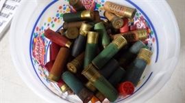 Bucket of 12 g, 16 g, 20 g shot gun shells.