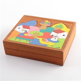 Guatemalan Painted Box: A Guatemalan painted box. This square wood box features a colorful scene to the top with animals and houses. It is signed, “M. Hall” to the front. It is marked, “Made in Guatemala” to the bottom.