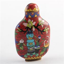 Chinese Cloisonne Snuff Bottle: A Chinese cloisonné snuff bottle. This red floral metal piece is covered in a colorful enameled design. There is a long brass dauber with a tiny spoon to the end. The piece is not marked.