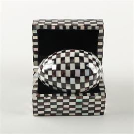 Mother of Pearl and Onyx Decorative Egg: A mother of pearl and onyx decorative egg with box. The egg is covered in mother of pearl and onyx checkers. The egg comes in a fitted box with a hinged lid lined in black felt.