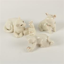 Lenox China Animal Figurines: A selection of Lenox china animal figurines. The selection includes a cat with a piece of cheese and a mouse titled “Making Friends” marked “Lenox” to the underside, a pig marked to the underside and a cat playing with a ball from the “Lenox China Jewels Collection”. The cat’s ball is inlaid with faux jewels.