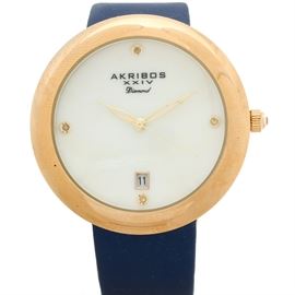 Akribos XXIV Mother of Pearl Diamond Dial Wristwatch: An Akribos XXIV quartz wristwatch featuring a mother of pearl dial with four diamond hour markers with a gold-tone case.