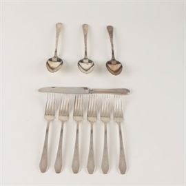 Oneida "Paul Revere" Silver Plate Flatware: A selection of Oneida Paul Revere silver plate flatware. This includes one knife, three serving spoons and five dinner forks. The pattern was first introduced in 1959 and features a floral design with plume accents comprised of a series of dots. Each piece bears the Oneida mark on the back.