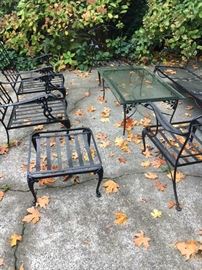 Wrought iron coffee table, three side chairs, ottoman and glider.  All come with cushions (not pictured)