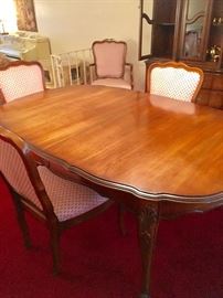 French Provincial  dining room table with 8 French chairs