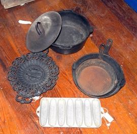 Lodge #8 Cast Iron Stock Pot, 10" & 8" Skillets, Corn Bread Mold, And Trivet