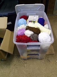 Assorted yarn, knitting needles, hat weaving rings
