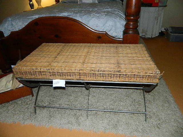 very unusual metal bench with straw top