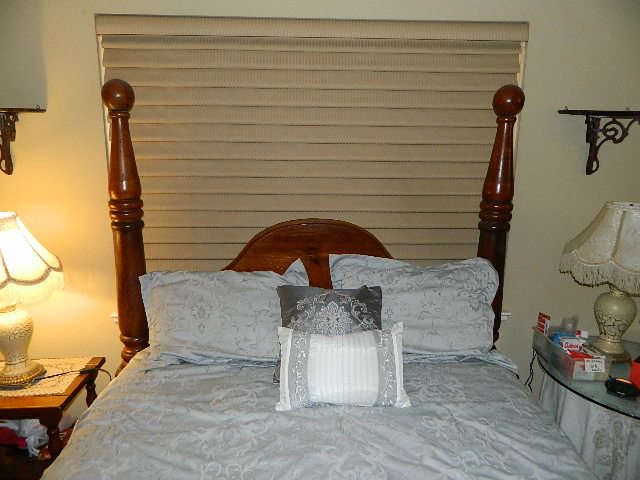 view of headboard of queen bed