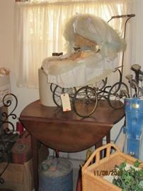 Small drop leaf table and antique baby buggy