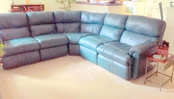 Leather reclining curved sectional. Perfect condition.