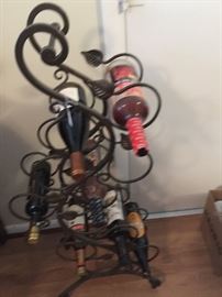 Wrought iron wine rack.  Holds 9 bottles.  Sorry, we can't sell the wine!   :)