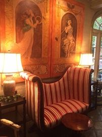 Empire style tall back loveseat with carved mahogany base