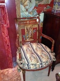 One of two hand-painted antique side chairs