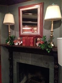Matching lamps, leather bound books, & foo dogs