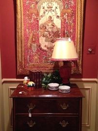 Small chest and antique wall tapestry