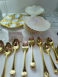 Oyster plate; gold colored flatware