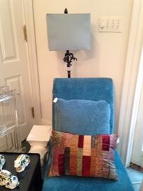 One of two matching chairs and lamps