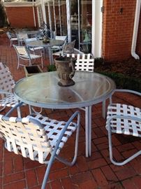 Three matching tables with four chairs each