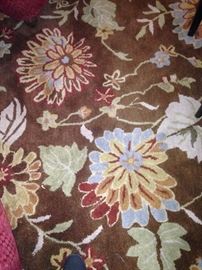 Brown, gold, and green rug