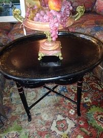 Black lacquered tray table; pink marble compote