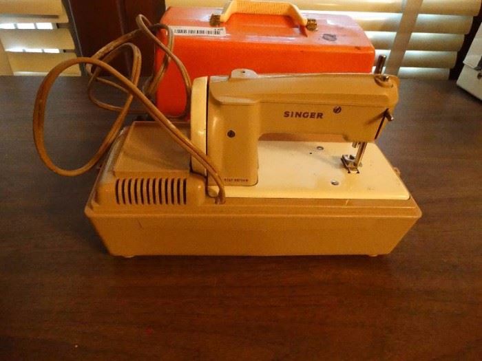 Mini vintage singer electric sewing machine. 