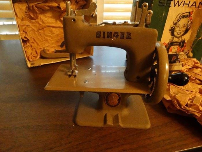 Mini vintage singer sewing machine.