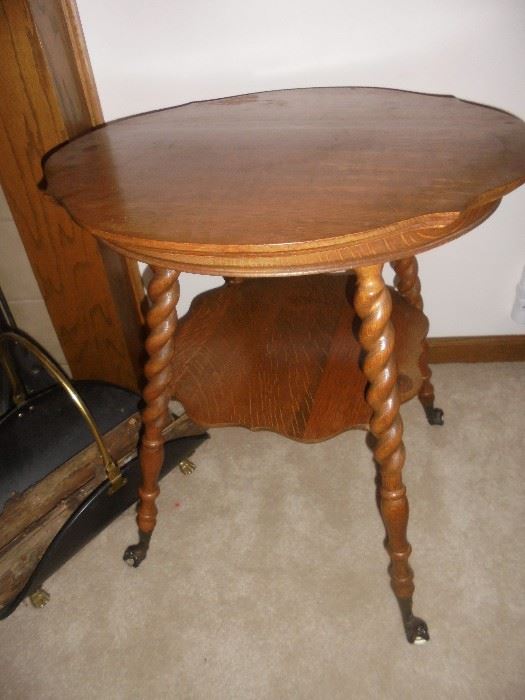 Parlor table with glass claw feet.