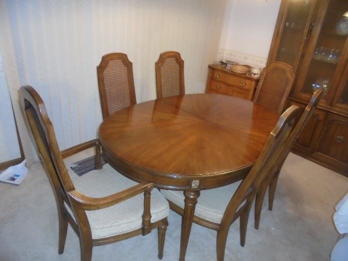Dining set includes 6 chairs, 2 leaves and protective pads.