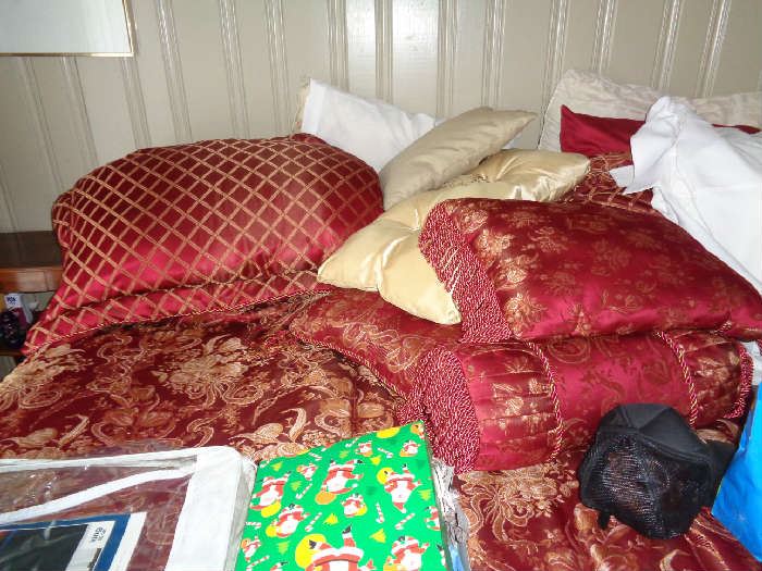 this is the queen bed covered in pillows