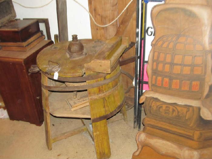 An old wooden washing machine. Needs to be restored.