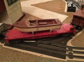 Flatbed car carrying boat