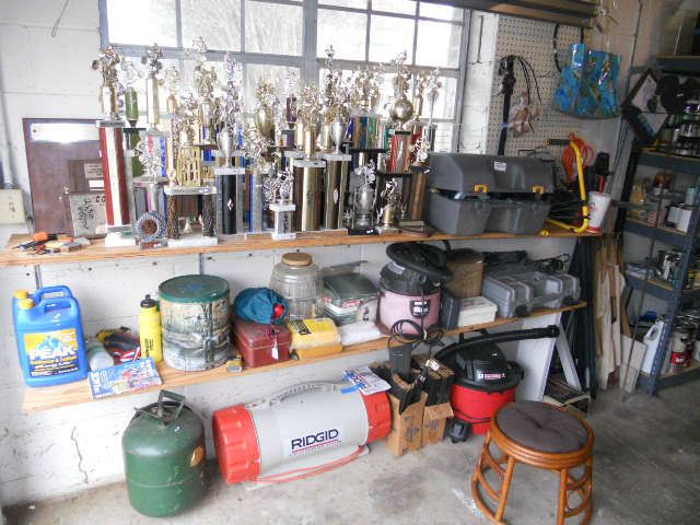 Ridgid Air Filtration System, Craftsman Shop Vac, Ryobi 14.4 Skil saw with light and drill assorted set, 1980's Motor cross trophies.
