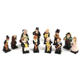 Royal Doulton Character Figurine Collection: A collection of twelve Royal Doulton character figurines. The figurines are all made of porcelain and are hand-painted. The characters include Sairey Gamp, Bill Sikes, Bumble, Little Nell, Captain Cuttle, David Copperfield, Dick Swiveller, Scrooge, Sam Weller, Micawber, Pickwick, and Tiny Tim.